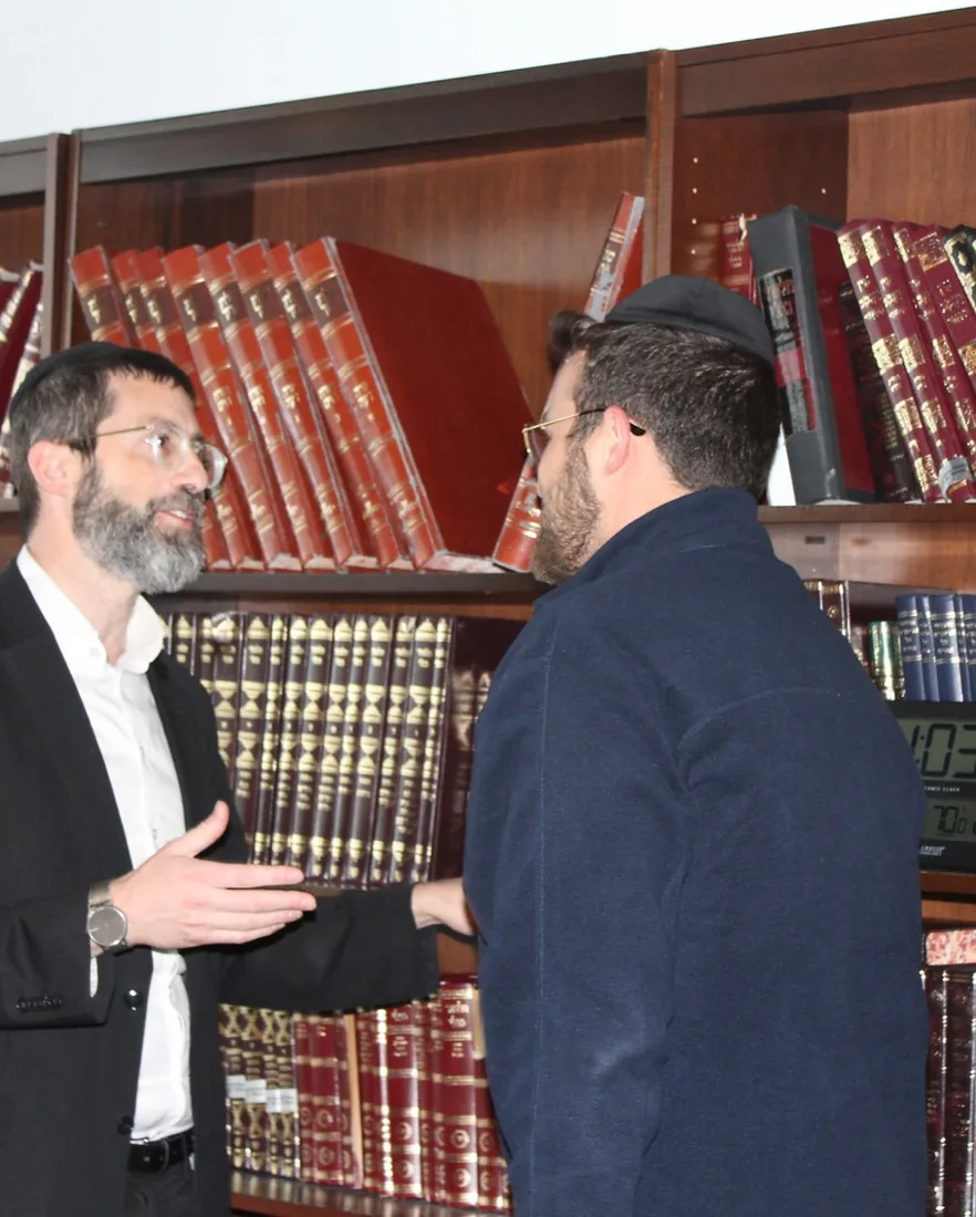 A study scene of books and writing, evoking Rabbi Kestenbaum&rsquo;s teaching and columns.